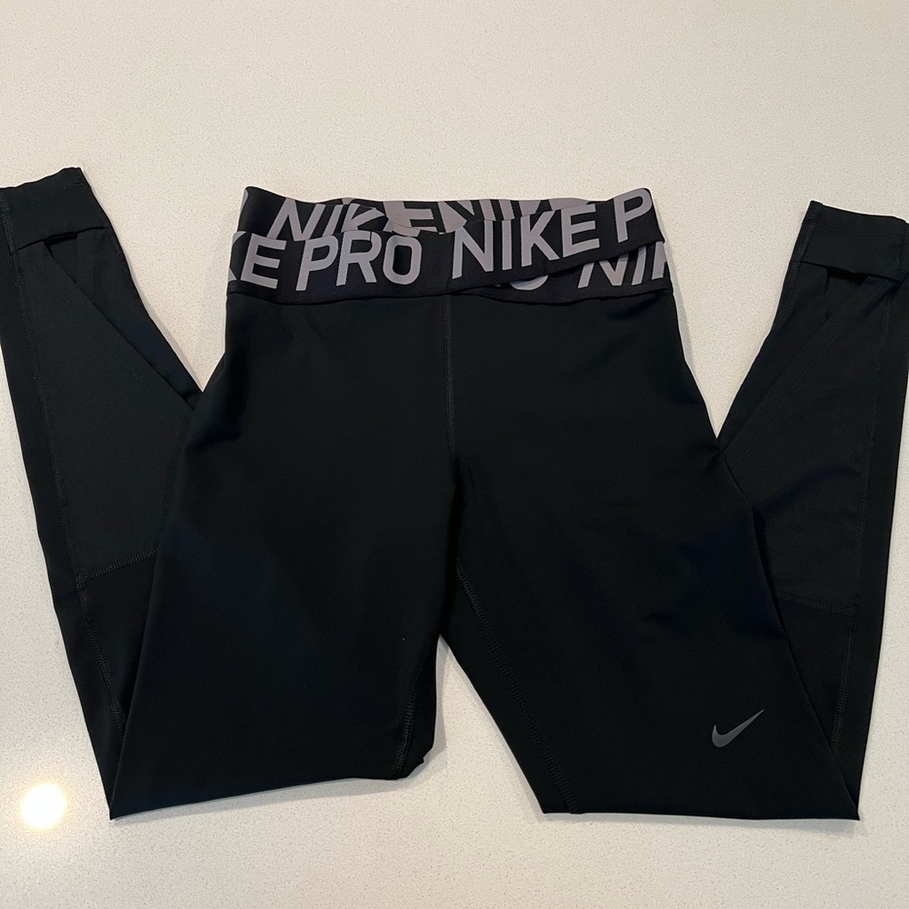 Nike Pro leggings with detail in low back legs